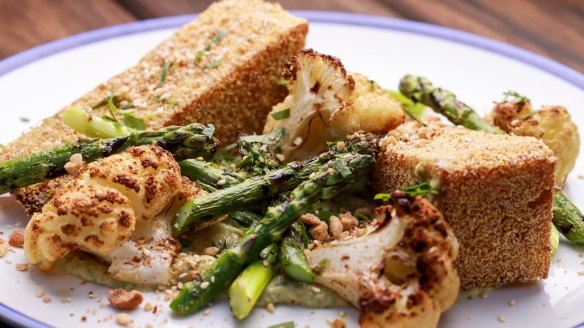 Vegan-friendly fried polenta with asparagus and cauliflower.