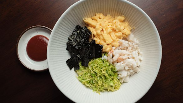 Bibimbap with spanner crab, brussels sprouts and egg.