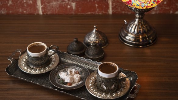 Turkish coffee is served in a hand-etched set.