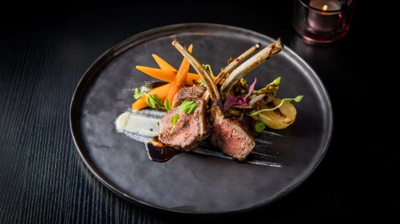 Char-grilled lamb rack with honey carrots, brussels sprouts and sweet miso mint sauce.