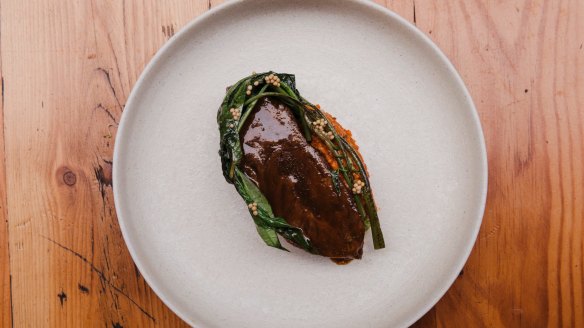 Luscious beef cheeks with capsicum and ong choy (water spinach).