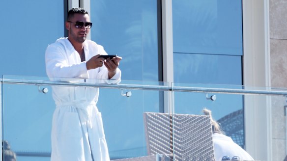 Salim Mehajer in a bathrobe with Melissa Tysoe on his balcony in Vaucluse. 