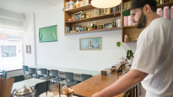 Clinton Serex behind the counter at Sundae School Ice Creamery.