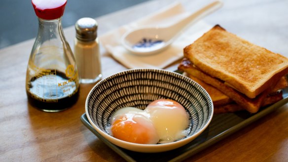 Kaya toast with onsen eggs and soy sauce and white pepper. 