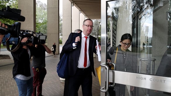Legal representatives arrive at the High Court in Canberra on Tuesday.