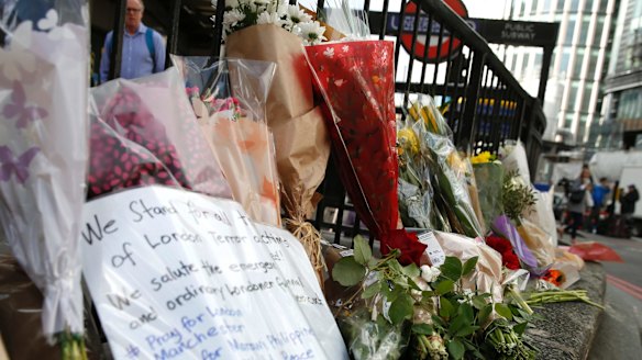Floral tributes line the pavement outside Monument underground station on Monday, June 5.