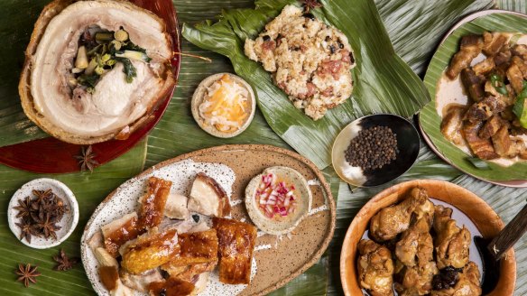 Clockwise from left: Cebu lechon (charcoal roast pork), longanisa fried rice, crisp bicol xpress (spicy fried pork belly in coconut curry), and humba na manok (braised soy chicken) from Sydney Cebu Lechon in Enmore.