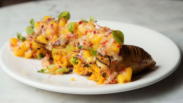 Squid stuffed with spiced chorizo paella and topped with mango salsa.