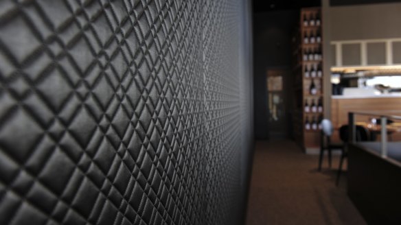 The black quilted feature wall highlights the contemporary feel at Aubergine. 