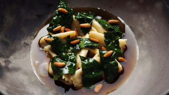 Slippery jack agnolotti with black cabbage and fresh pinenuts.