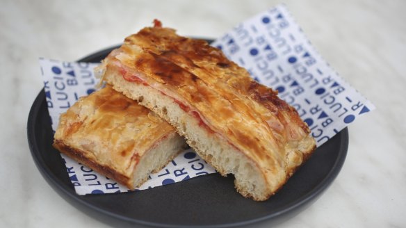The cafe serves stacks of flaky focaccia.