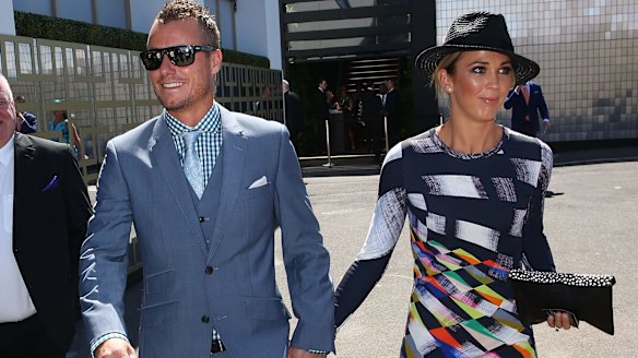 Lleyton and Bec Hewitt arrive at the Swisse marquee. 