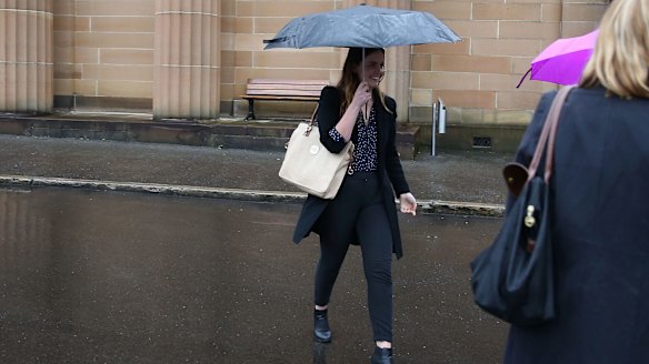 Lucy McNamara tries to evade the media after Friday's sentencing.