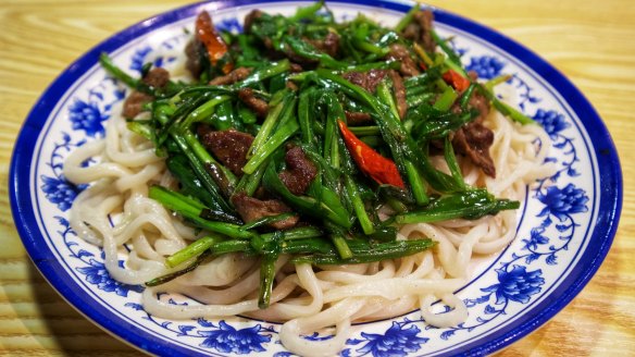 Go-to dish: Wheat noodles with chives and sliced lamb.