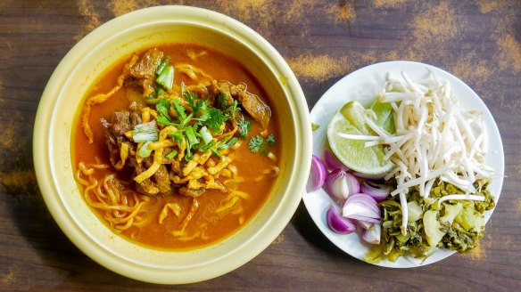 Khao soi curried noodle soup with chicken, a popular northern Thai dish. 