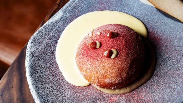 6 Head's doughnut is a sugared puffball with creme anglaise, fig sauce and strawberry powder.