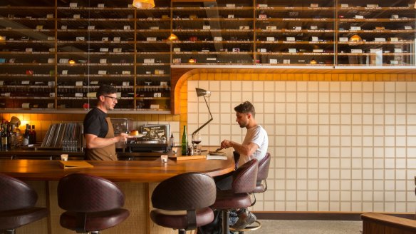 The 300-plus wine selection dominates the bar.