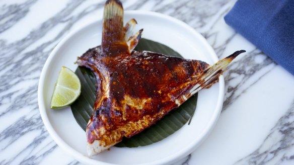 Chargrilled kingfish collar is sticky, saucy fun.