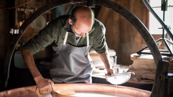 Cheese production at Alp Tsermont at the foot of Moleson, near Gruyeres.