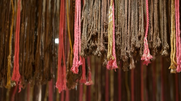Distressed, hand-dyed rope hanging from the roof represents the handmade pasta hanging out to dry in the sun.