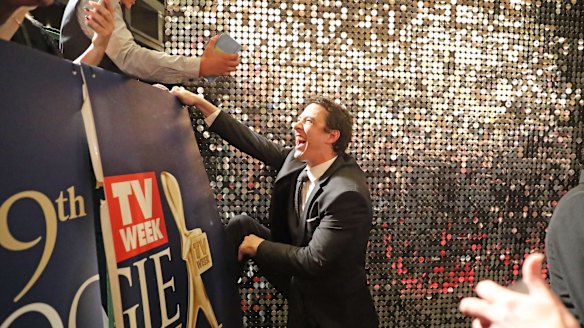 Gold Logie winner Samuel Johnson climbs into the crowd to meet fans at the 59th Annual Logie Awards at Crown.