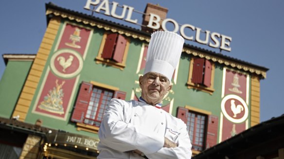 Paul Bocuse poses outside his famed Michelin three-star restaurant L'Auberge du Pont de Collonges in Collonges-au-Mont-d'or, central France.