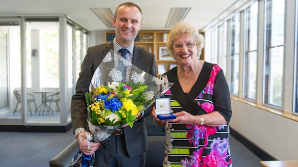 Chief Minister Andrew Barr awards Narelle Hargreaves with the ACT Citizen of the Year.