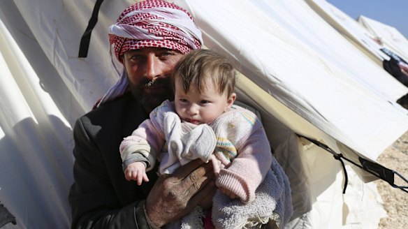 Displaced Syrians at a temporary refugee camp in northern Syria near the Bab al-Salameh border crossing with Turkey.