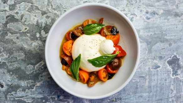 Burrata, macerated tomatoes, aged balsamic vinegar, and basil.