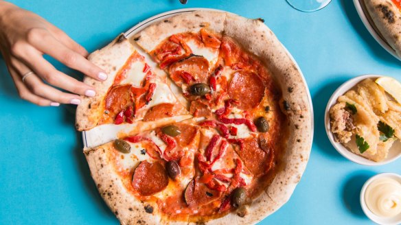 Each DIY pizza kit contains four sourdough balls, ready to stretch, toss and top at home.