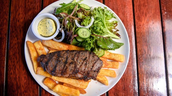 Steak with salad and chips.