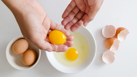 One method is to break the egg and, using your hand as a strainer, cradle the yolk in your fingers and let the white fall through them into a bowl.
