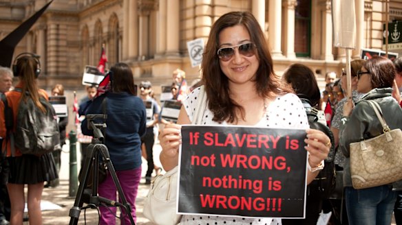 Protestors rally against slavery of migrant workers in Qatar in Sydney in 2013. 