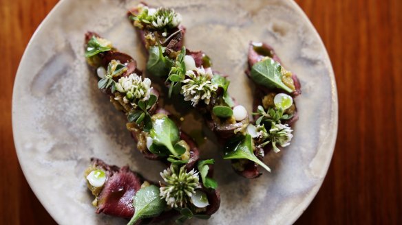 Charred kangaroo, gubinge, grasses and wild garlic at Orana.