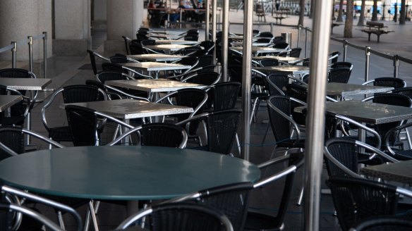 Empty tables at a restaurant in Circular Quay in Sydney, on Saturday.