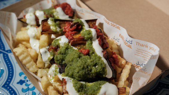 Loaded box with fries, eggplant, mint yoghurt and green chutney.