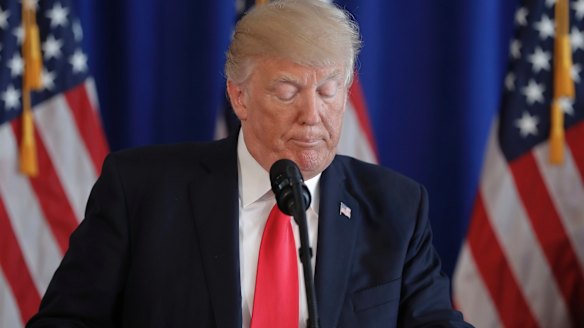 Donald Trump pauses while speaking about the violence in Charlottesville. 