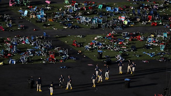 Investigators work at a festival grounds across the street from the Mandalay Bay Resort and Casino.