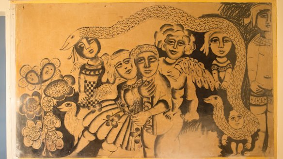 The little boy in the bottom right corner of the mural was uncovered first.