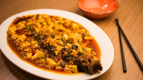 Braised whole barramundi with mapo tofu.