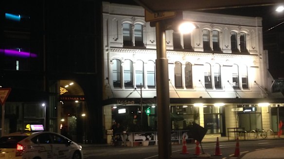 One of the few nightspots that gleam like white teeth among the black gaps