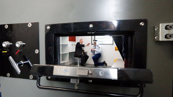Attorney-General Brad Hazzard and NSW Corrective Services Commissioner Peter Severin  in the cell. 