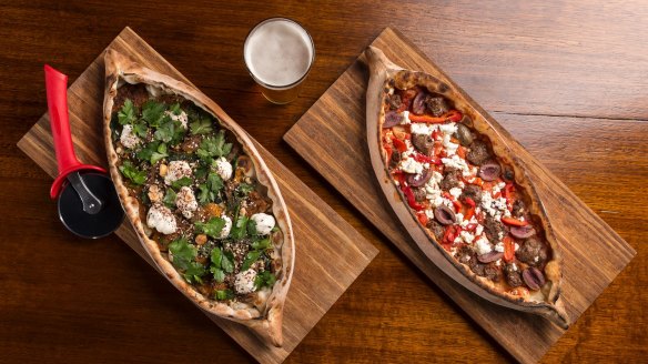 Istanbuli pide with pumpkin, spinach, caramelised onion, tahini yoghurt and dukkah (left); and Sultan Mehmet pide with tomato, lamb, red pepper, feta and oilves, at the new Moor's Head.