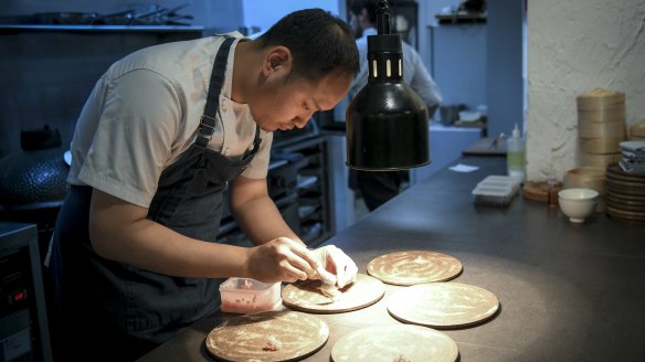Chef-owner Mo Zhou plating up.