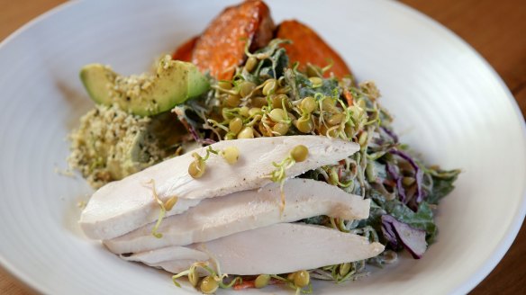 Go-to dish: Sweet potato, chicken, avocado hummus, sprout and cabbage slaw with nut milk dressing.