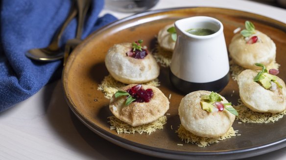 Golgappa filled with potato and green chilli and served with tamarind dressing.