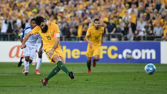 Mile Jedinak scores from the penalty spot the first time around.