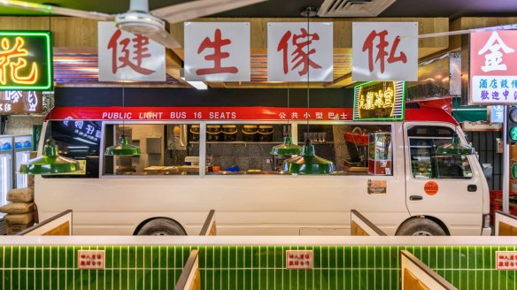 Traffic signs and a minibus recreate a streetscape at Kowloon Cafe in Burwood.