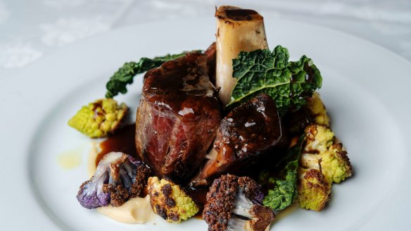 Braised venison shank on cauliflower puree, romanesco and Tuscan kale.