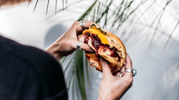 Beef burger with wagyu patty, sticky cheese, beetroot and pickles. 